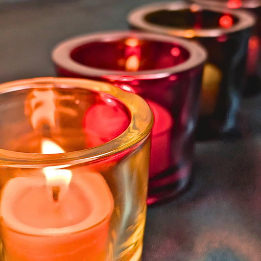 beeswax tea lights in recycled glass candle holders