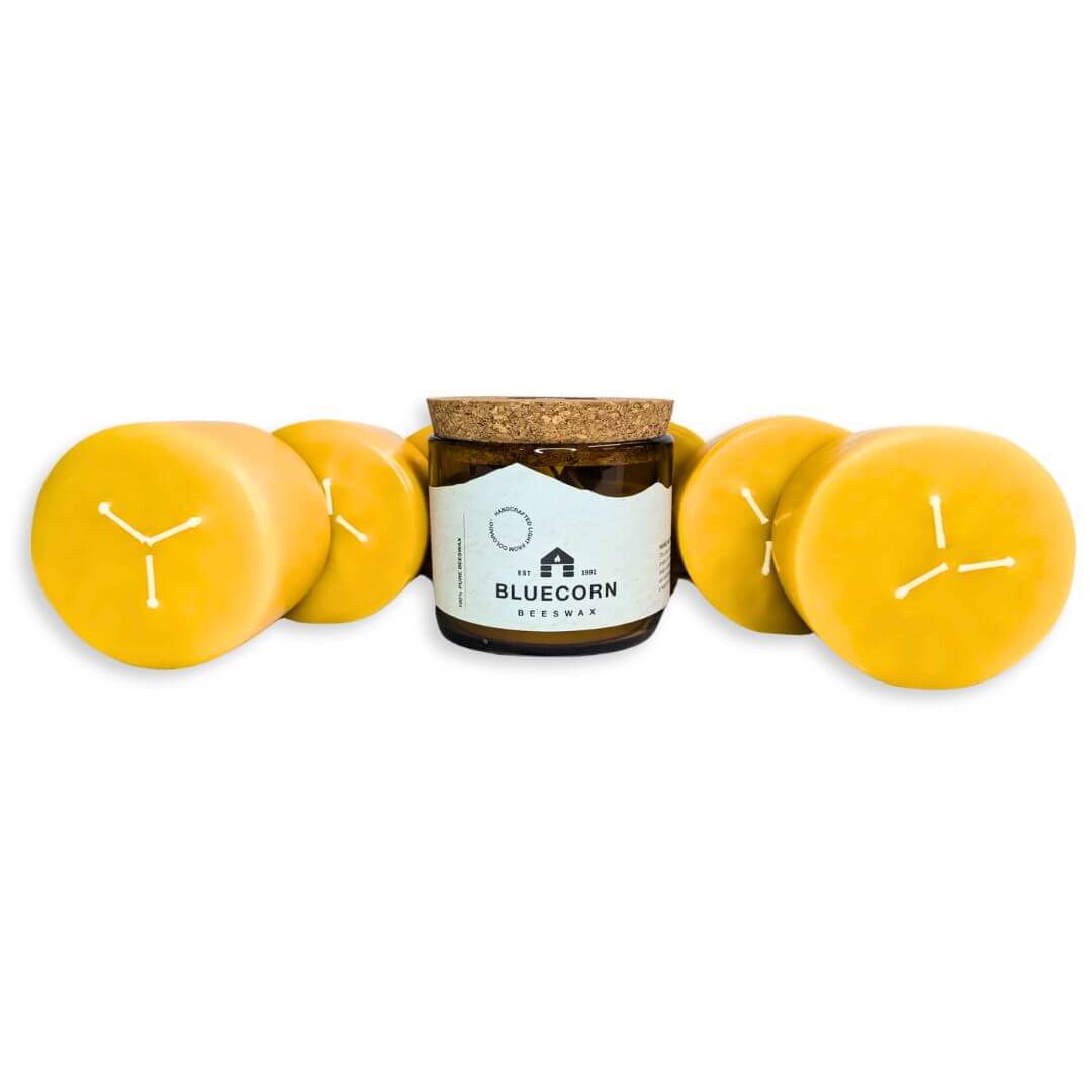 Jar of Bluecorn beeswax candles on a white background