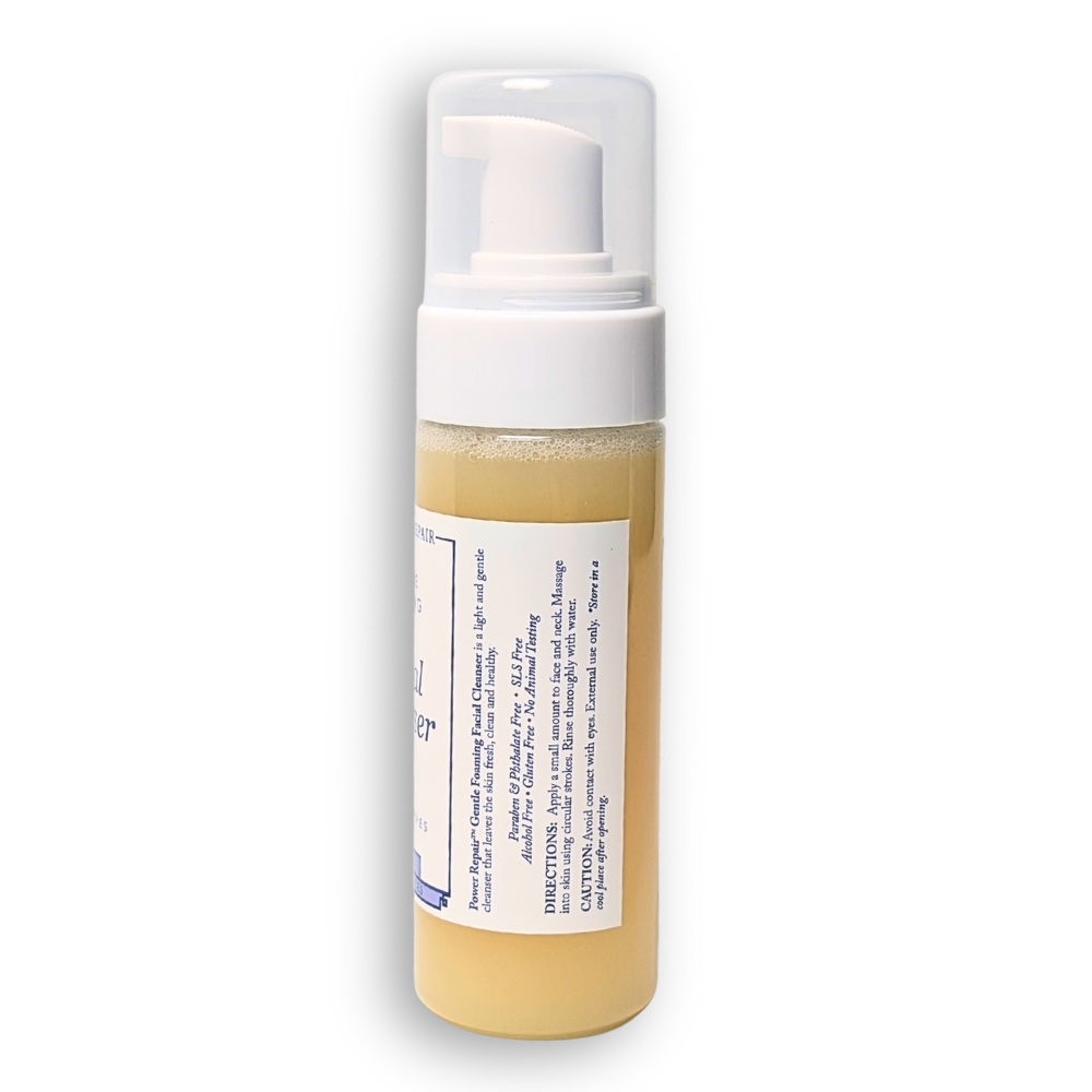 Foam bottle with a white pump and beige liquid on a white background