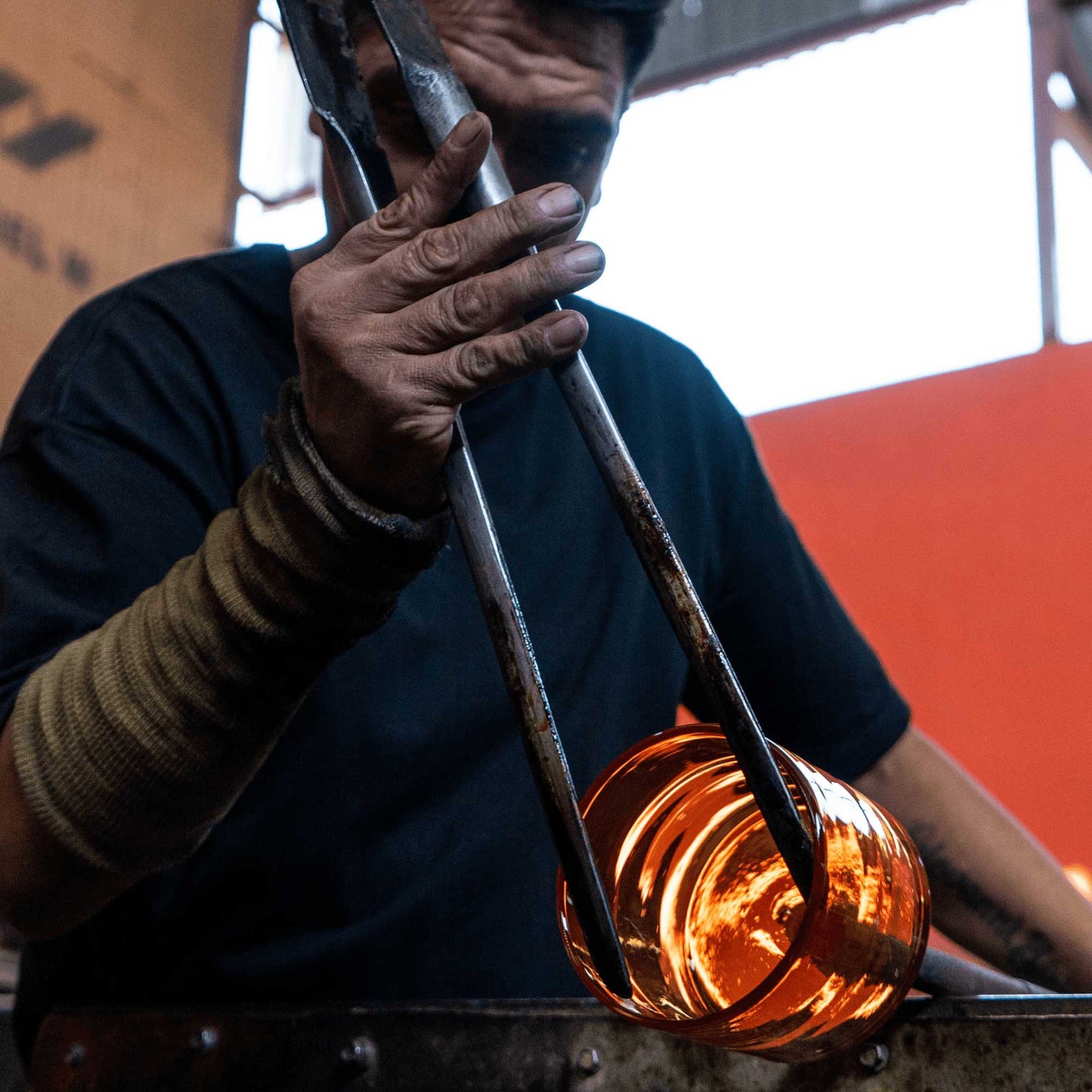 a craftsman shapes bluecorn candles blown glass candle holder made from 100% post consumer recycled content