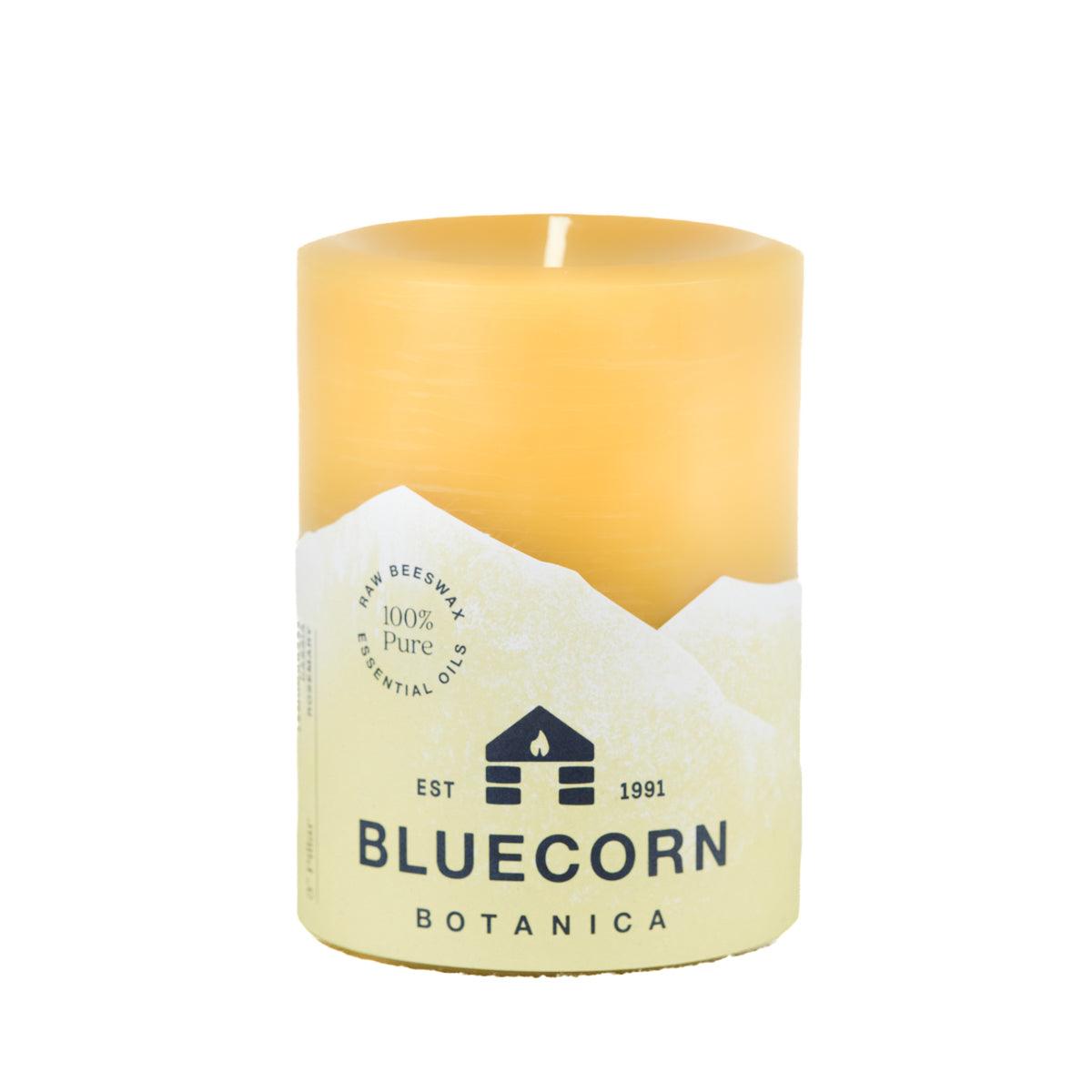Bluecorn Botanica 100% Pure Beeswax Lemongrass, Cassia and Rosemary 3" x 4" Scented Pillar Candle. Burn Time: 60 hours. Made with 100% Pure Beeswax, 100% Pure Essential Oils, and a 100% pure cotton wick, no lead. Candles are paraffin free, clean burning and non-toxic. Features Bluecorn Botanica label in Yellow printed on 100% recycled paper. Wax is golden in color.