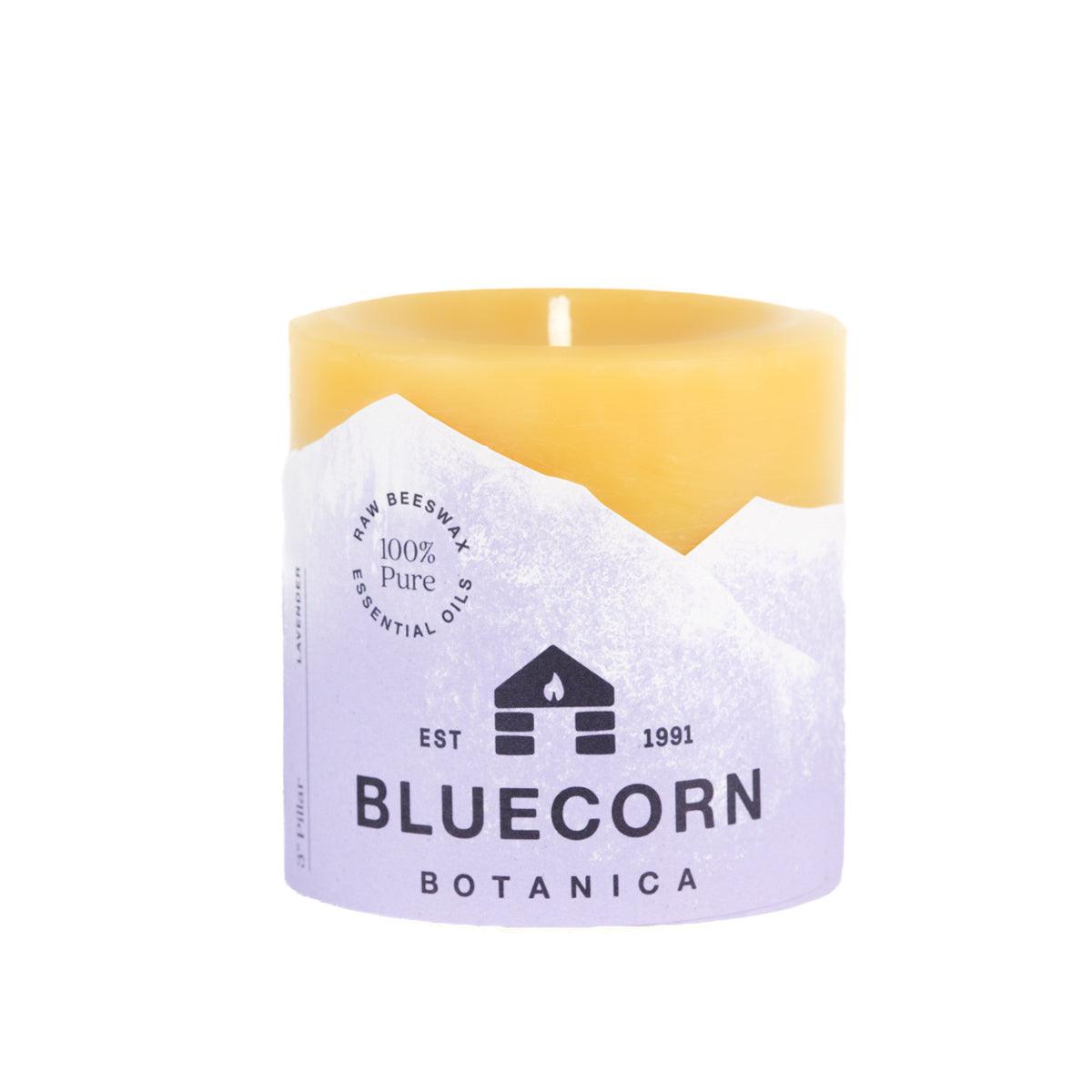 Bluecorn Botanica 100% Pure Beeswax Lavender 3" x 3" Scented Pillar Candle. Burn Time: 50 hours. Made with 100% Pure Beeswax, 100% Pure Essential Oils, and a 100% pure cotton wick, no lead. Candles are paraffin free, clean burning and non-toxic. Features Bluecorn Botanica label in purple printed on 100% recycled paper. Wax is golden in color.