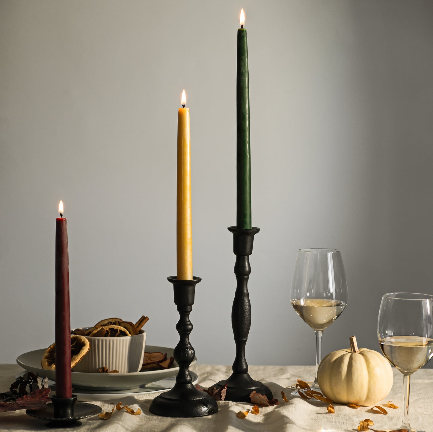 thanksgiving candle display bluecorn beeswax taper candles in raw beswax, burgundy candles and dark green candlsticks