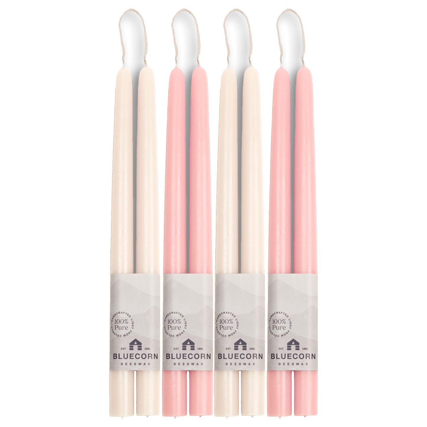 white taper candles, two pairs, and light pink candlesticks, two pairs, made from pure beeswax in Colorado by Bluecorn Candles