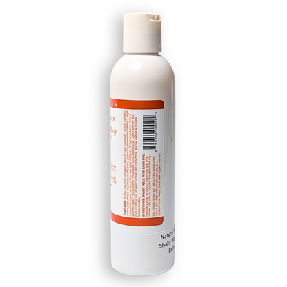 White bottle with a red label on a white background