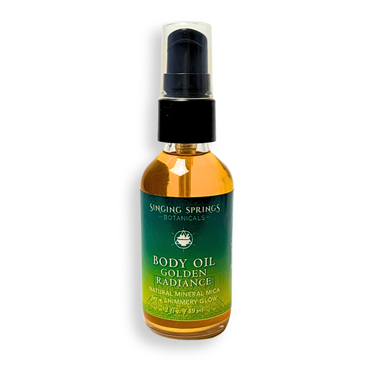 Bottle of Singing Springs Botanicals Body Oil Golden Radiance on a white background