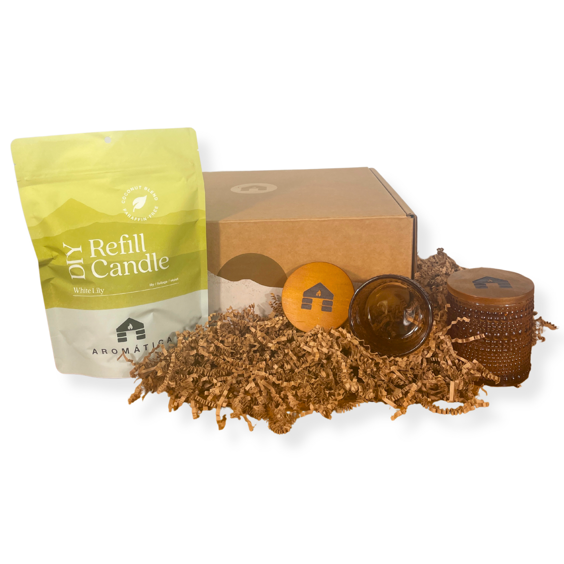 DIY candle refill kit with packaging, candle wicks, and a glass container on a white background.