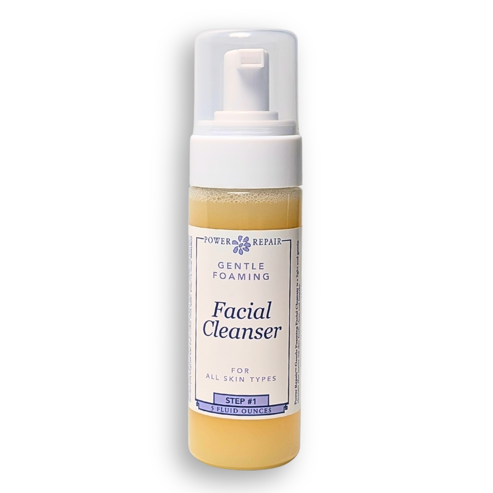 Facial cleanser bottle with pump on a white background