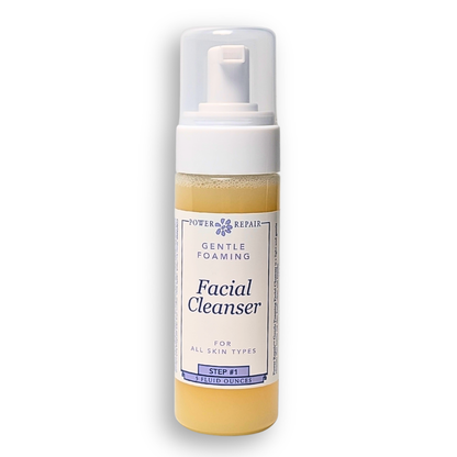 Facial cleanser bottle with pump on a white background