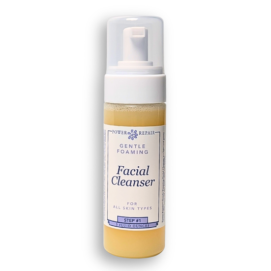 Facial cleanser bottle with pump on a white background
