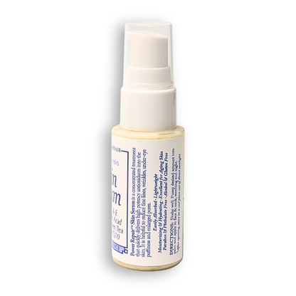 Skincare serum bottle with white cap on a white background