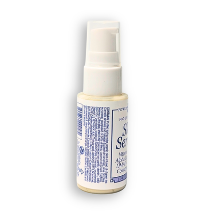 Small spray bottle with a label on a white background