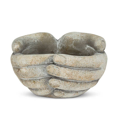 Decorative stone bowl with a hand-like design on a white background