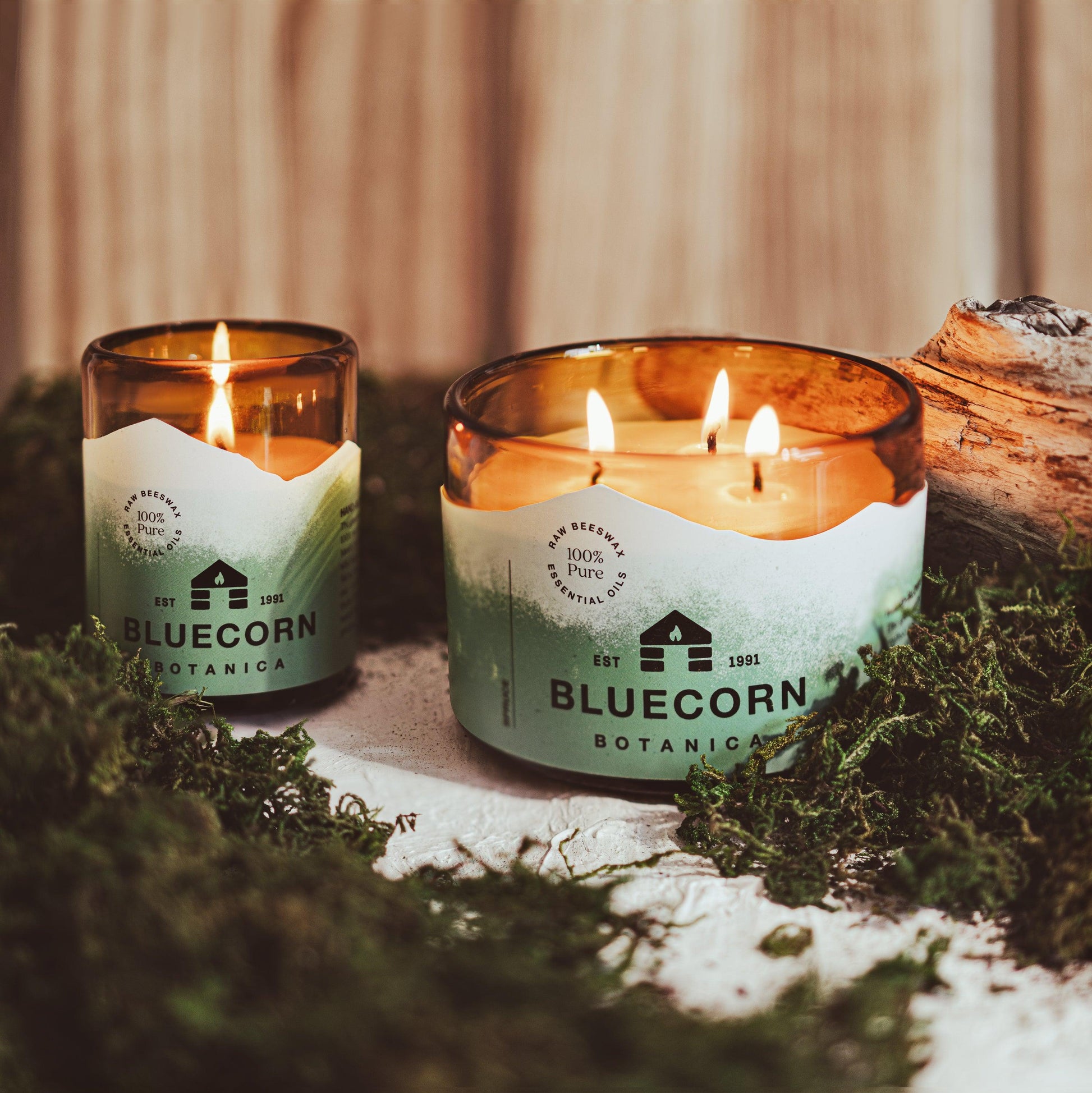 bluecorn botanica beeswax candles scented with spruce essential oil in a blown glass holder