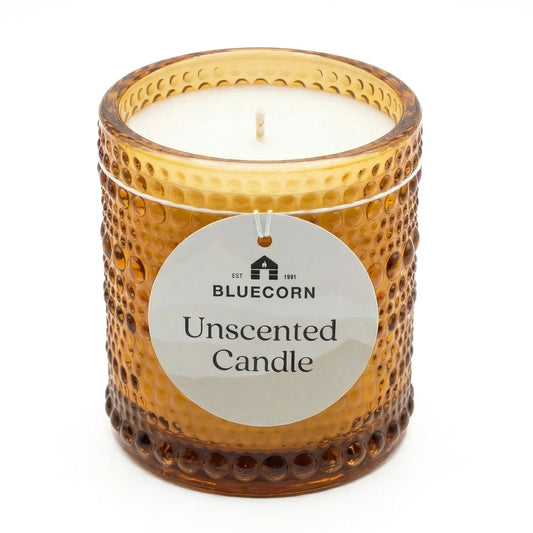 Small and large unscented coconut wax candles in amber glass jars with wooden lids by Bluecorn Candles