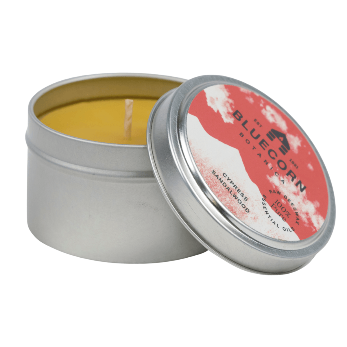 Bluecorn Botanica Cypress and Sandalwood 100% Pure Beeswax Travel Tin Candle. Burn Time: 6oz Candle: 30 Hours. 2oz Candle 12 Hours. Made with 100% Pure Beeswax and 100% Pure Essential Oils. Made with 100% pure cotton wick, no lead and paraffin free. Clean burning and non-toxic. Features Bluecorn Botanica Label in recyclable aluminum tin. Perfect for travel, camping and gifts. 