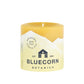 Bluecorn Botanica 100% Pure Beeswax Lemongrass, Cassia and Rosemary 3" x 3" Scented Pillar Candle. Burn Time: 50 hours. Made with 100% Pure Beeswax, 100% Pure Essential Oils, and a 100% pure cotton wick, no lead. Candles are paraffin free, clean burning and non-toxic. Features Bluecorn Botanica label in Yellow printed on 100% recycled paper. Wax is golden in color. 