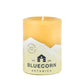 Bluecorn Botanica 100% Pure Beeswax Lemongrass, Cassia and Rosemary 3" x 4" Scented Pillar Candle. Burn Time: 60 hours. Made with 100% Pure Beeswax, 100% Pure Essential Oils, and a 100% pure cotton wick, no lead. Candles are paraffin free, clean burning and non-toxic. Features Bluecorn Botanica label in Yellow printed on 100% recycled paper. Wax is golden in color. 