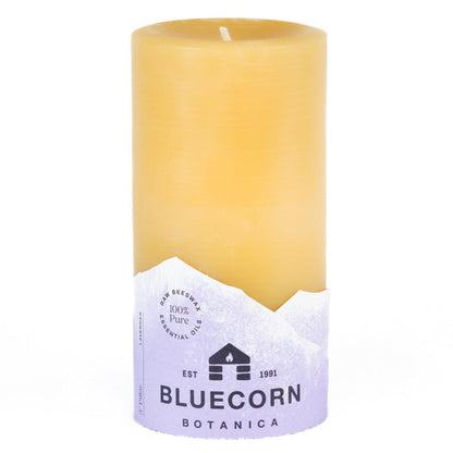 Bluecorn Botanica 100% Pure Beeswax Lavender 3" x 6" Scented Pillar Candle. Burn Time: 90 hours. Made with 100% Pure Beeswax, 100% Pure Essential Oils, and a 100% pure cotton wick, no lead. Candles are paraffin free, clean burning and non-toxic. Features Bluecorn Botanica label in purple printed on 100% recycled paper. Wax is golden in color. 