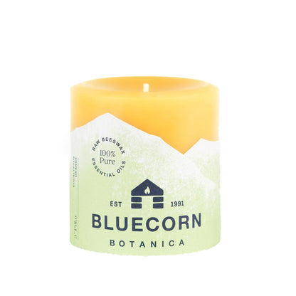 Bluecorn Botanica 100% Pure Beeswax Eucalyptus & Orange 3" x 3" Scented Pillar Candle. Burn Time: 50 hours. Made with 100% Pure Beeswax, 100% Pure Essential Oils, and a 100% pure cotton wick, no lead. Candles are paraffin free, clean burning and non-toxic. Features Bluecorn Botanica label in Green printed on 100% recycled paper. Wax is golden in color.