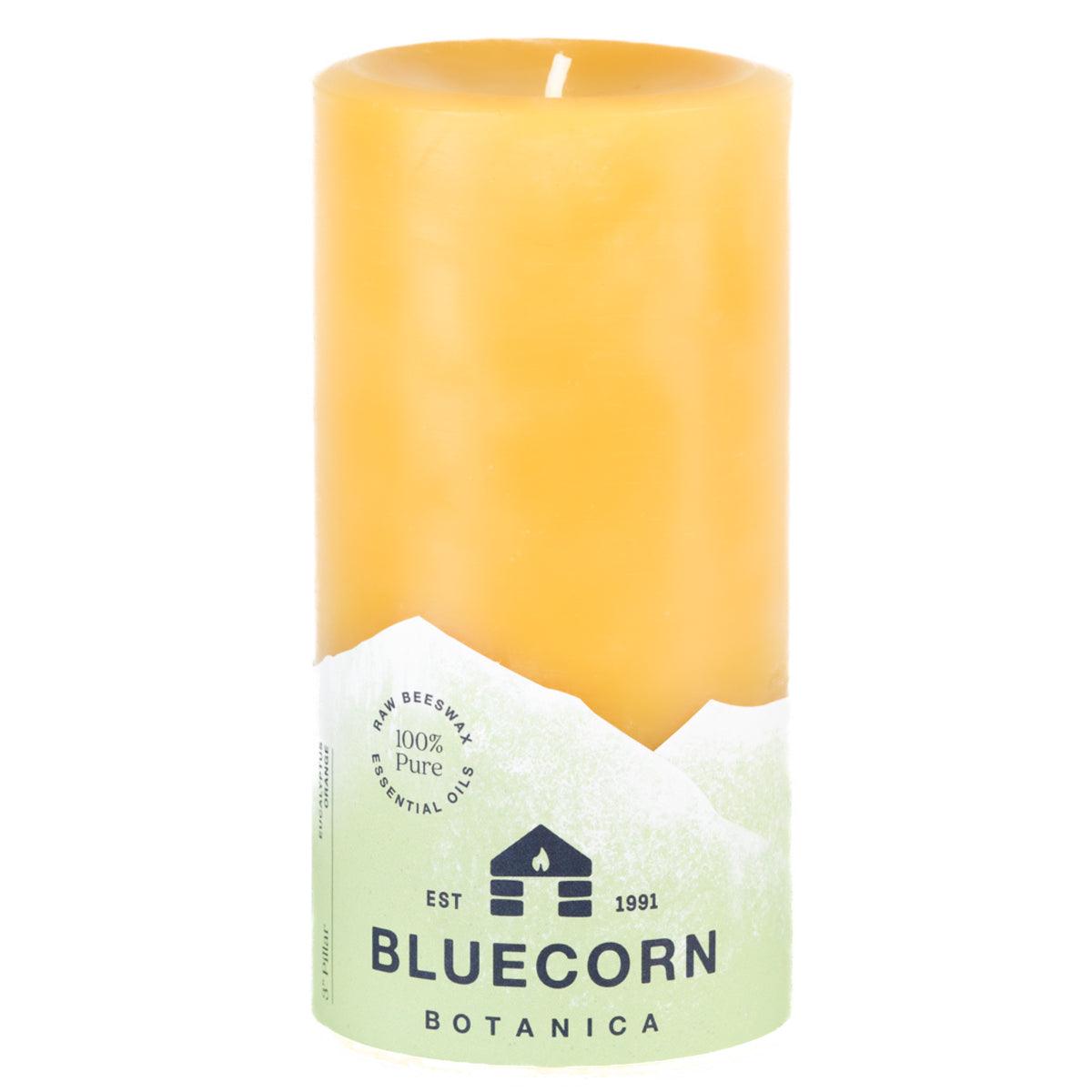 Bluecorn Botanica 100% Pure Beeswax Eucalyptus & Orange 3" x 6" Scented Pillar Candle. Burn Time: 90 hours. Made with 100% Pure Beeswax, 100% Pure Essential Oils, and a 100% pure cotton wick, no lead. Candles are paraffin free, clean burning and non-toxic. Features Bluecorn Botanica label in Green printed on 100% recycled paper. Wax is golden in color.
