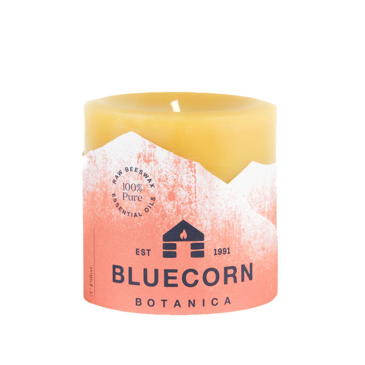 Bluecorn Botanica 100% Pure Beeswax Tangerine and Geranium 3" x 3" Scented Pillar Candle. Burn Time: 50 hours. Made with 100% Pure Beeswax, 100% Pure Essential Oils, and a 100% pure cotton wick, no lead. Candles are paraffin free, clean burning and non-toxic. Features Bluecorn Botanica label in Orange printed on 100% recycled paper. Wax is golden in color. 