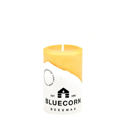 Bluecorn Beeswax 100% Pure Beeswax 2" x 3" Raw Pillar Candle. Burn Time: 25 Hours. Made with 100% pure cotton wick, no lead and paraffin free . Wax is golden and color and label features Bluecorn label printed on white 100% recycled paper there might be an odd blemish or a small air bubble on the surface of the candle. It is often the case that folks can't even see the flaw. Rest assured, they will burn beautifully.