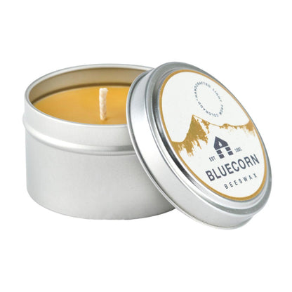Bluecorn Beeswax Raw 6oz Travel Tin with lid open. Wax is golden in color and packing features the bluecorn logo on a white and gold foil sticker. 
