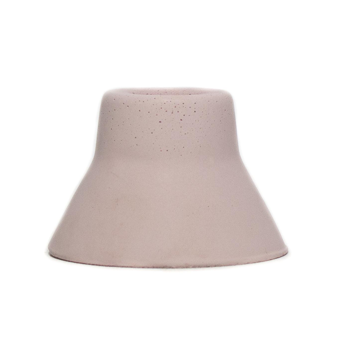 Soft pink concrete taper candle holder. 3" base narrows to about an 1" at the top and fits a standard Bluecorn Beeswax taper candle.