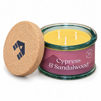 cypress and sandalwood scented 3-wick beeswax candle from bluecorn candles on white background with cork lid with cabin logo in the center