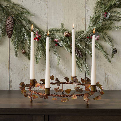 Ginkgo Advent wreath taper candle holder displayed as a glowing holiday centerpiece with lit taper candles in a home setting