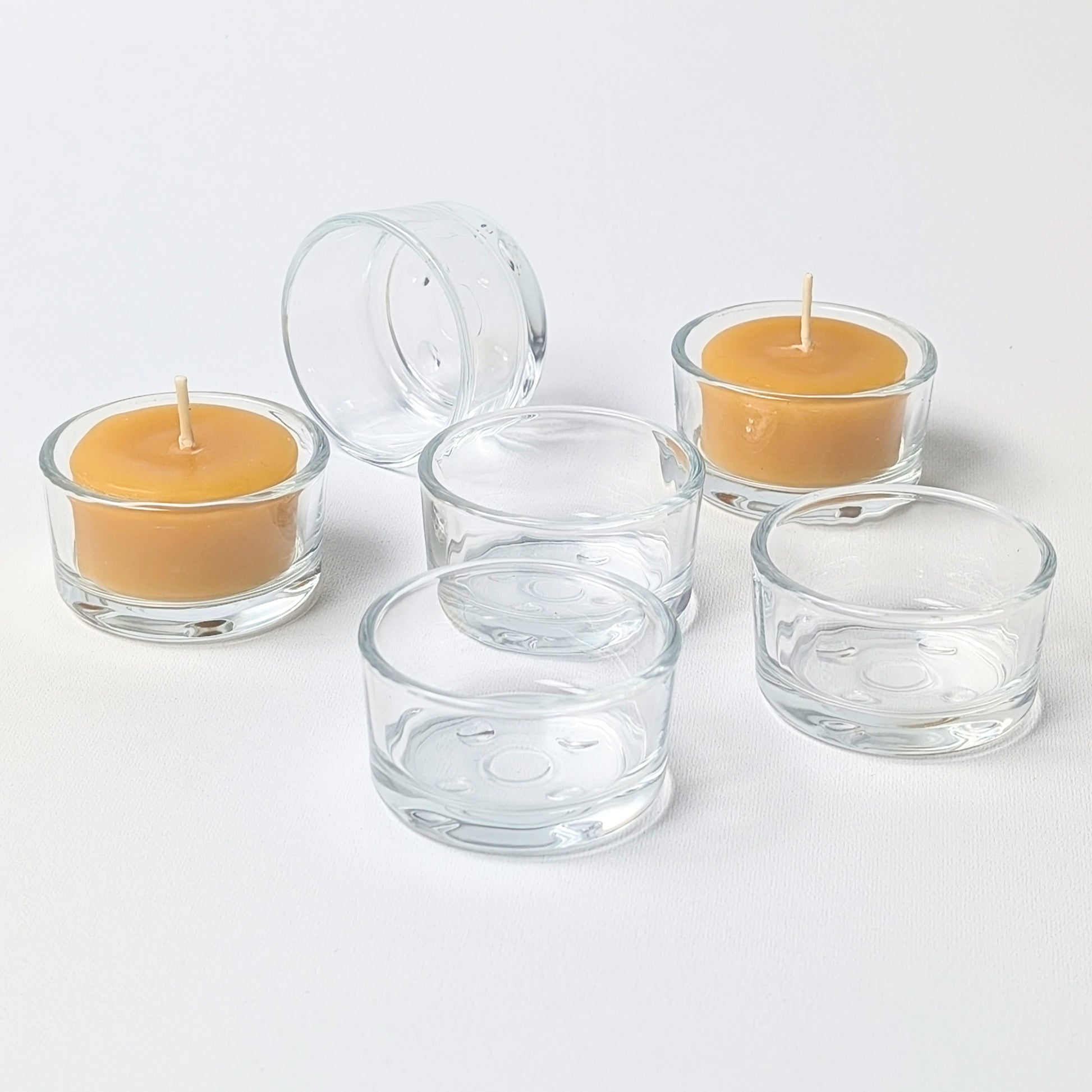 bluecorn beeswax tealight candles in clear glass candle holders