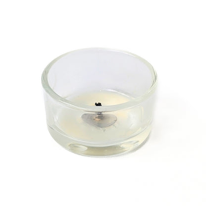 bluecorn beeswax tea light fully burned in refillable glass tea light holder