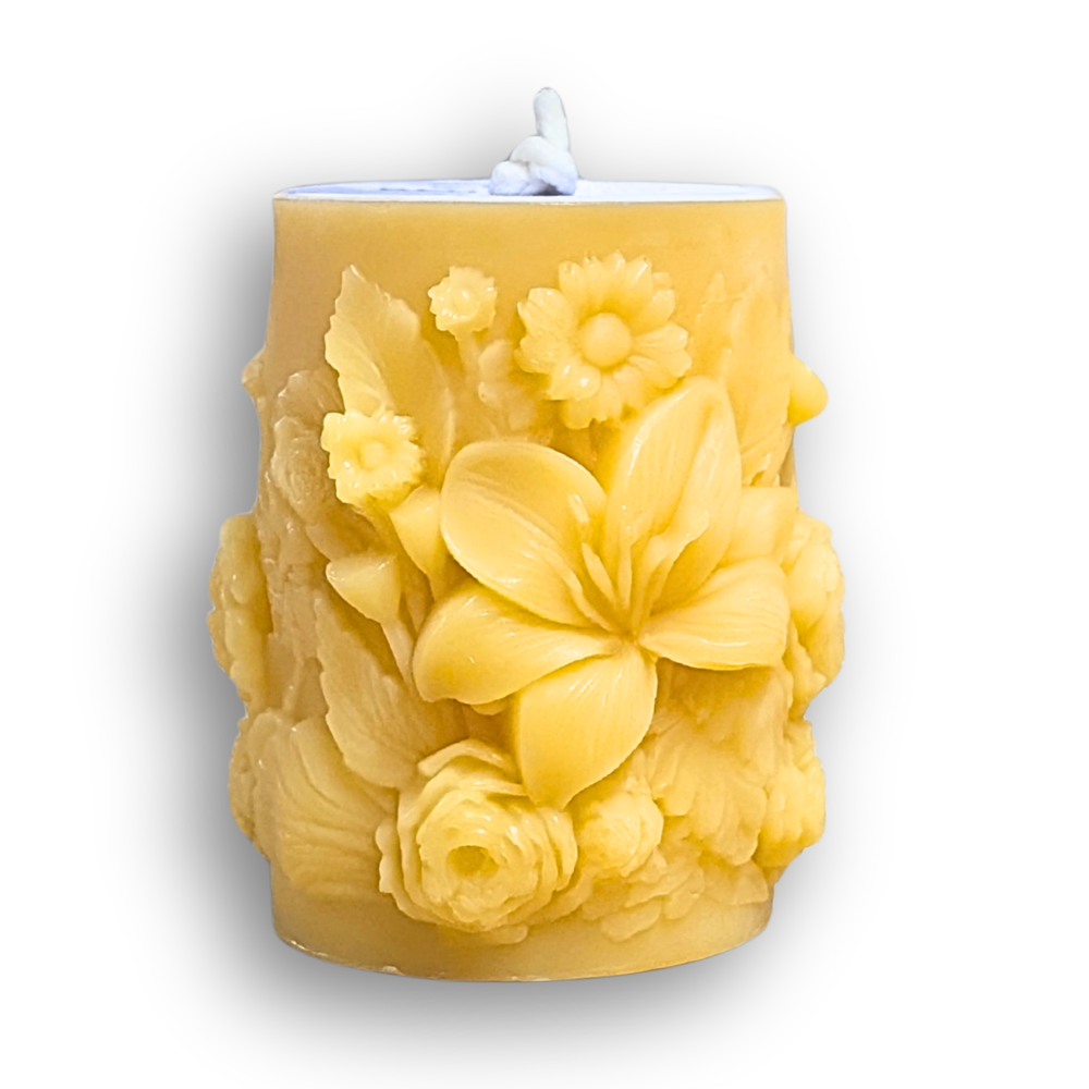 scented beeswax pillar candle with floral designs scented with essential oils
