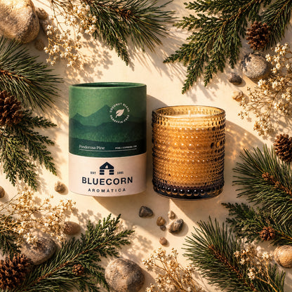ponderosa pine scented christmas tree candle fro bluecorn with scent elements surrounding 