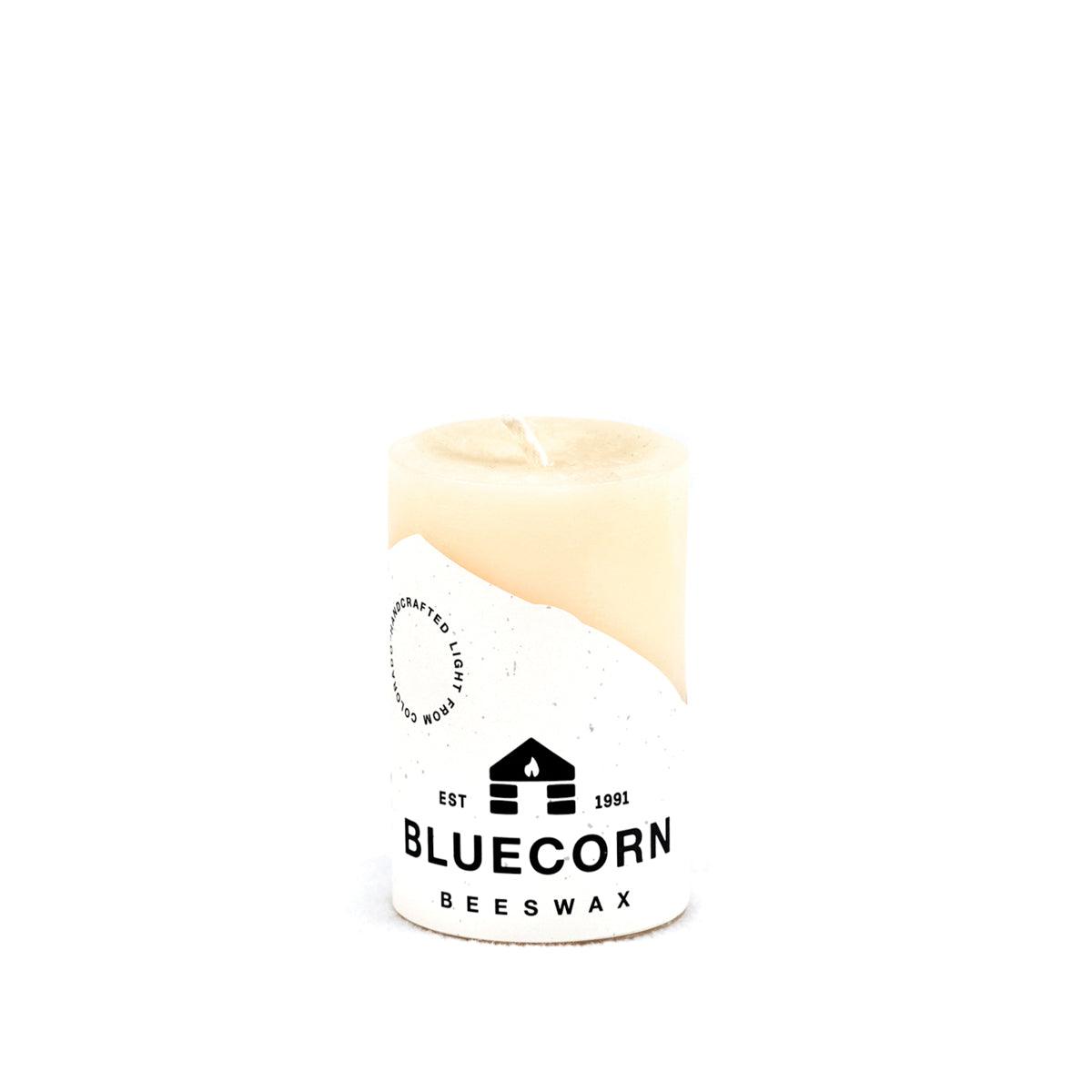 Bluecorn Beeswax 100% Pure Beeswax 2" x 3" Ivory Pillar Candle. Burn Time: 25 hours. Made with 100% Pure Beeswax, is white in color. Made with 100% pure cotton wick, no lead and paraffin free. Clean burning and non-toxic. Features Bluecorn Beeswax label printed on 100% recycled paper.