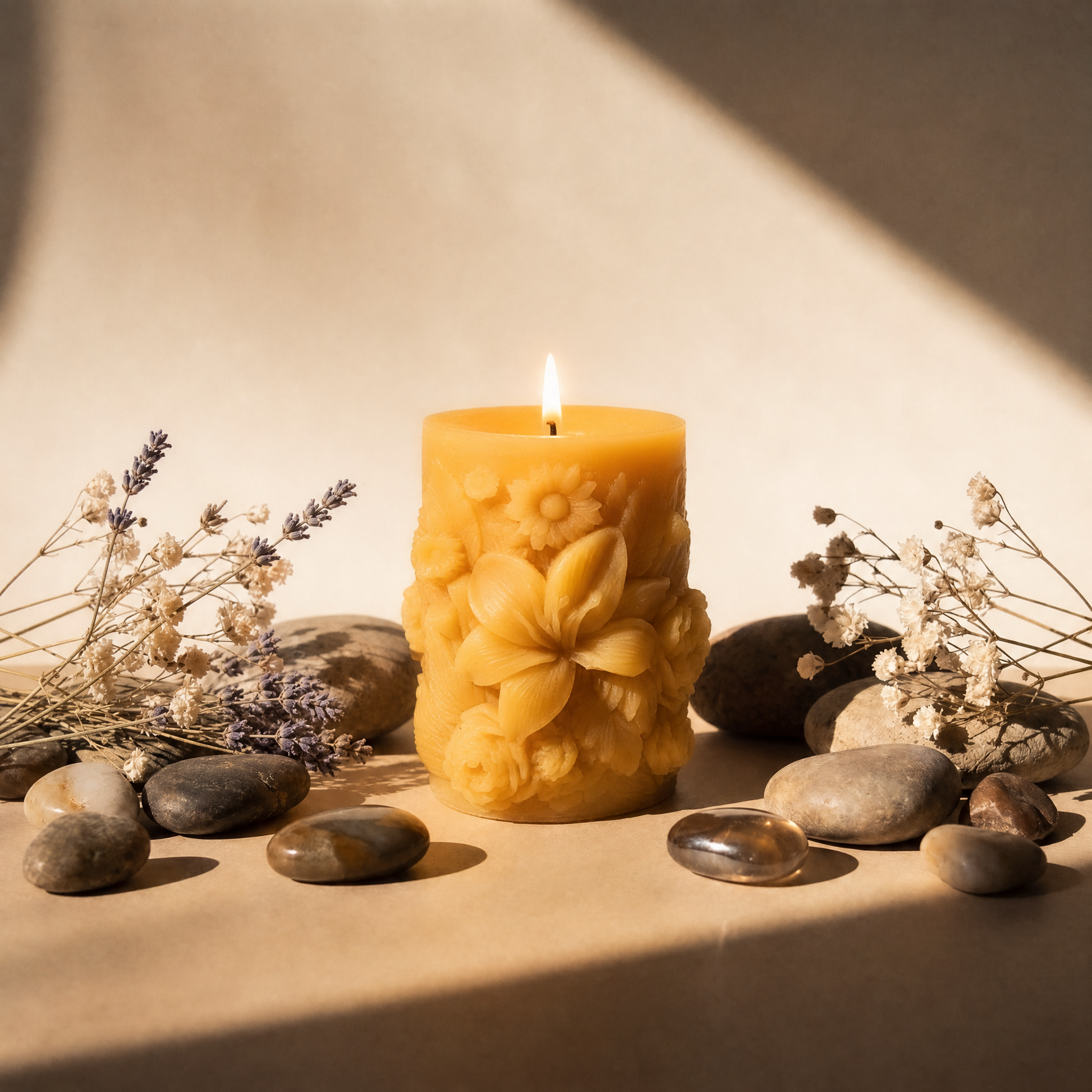 bluecorn beeswax pillar candle with sculptural floral motif glowing in western decor