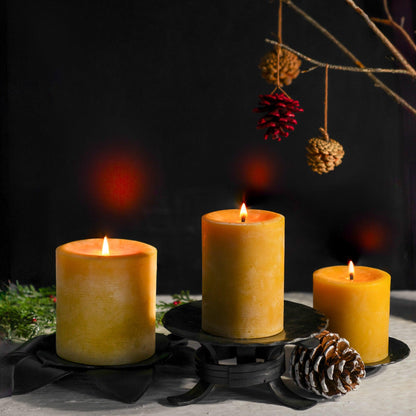Glow Trio beeswax pillars styled as a holiday centerpiece