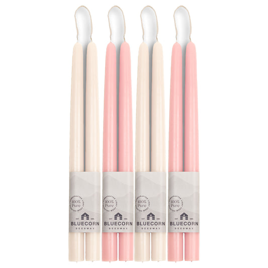 white taper candles, two pairs, and light pink candlesticks, two pairs, made from pure beeswax in Colorado by Bluecorn Candles