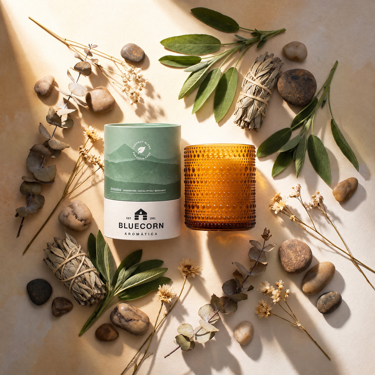 sage eucalyptus and bergamot scented candle form bluecorn Artemisa pictured here as a flat lay with scent components surrounding 