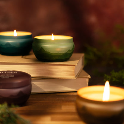 scented candles in tins with mountain range design variety of colors bluecorn