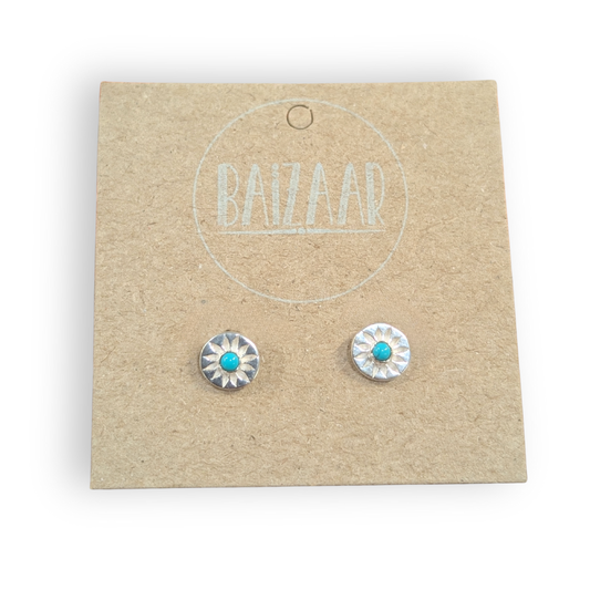 Pair of silver earrings with turquoise stones on a 'BAIZZAR' branded card.